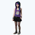 Person with colorful hair standing in a room decorated with music posters and vinyl records.